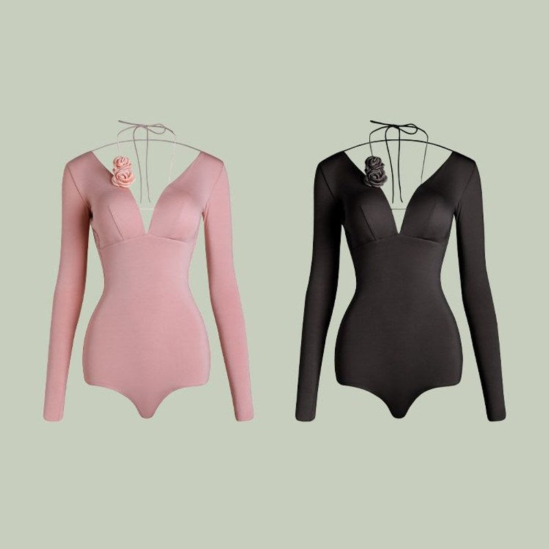 Pink, Black deep V long sleeve Latin dance bodysuit, flat lay of both colours
