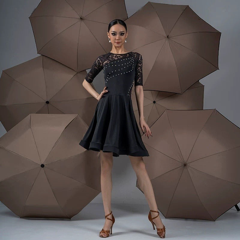 Black lace and rhinestone latin salsa dance dress, front view with flared hem