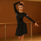 Black long sleeve latin salsa practice dress with an asymmetric flared hem