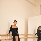 Black long sleeve dance dress with high slit, front view