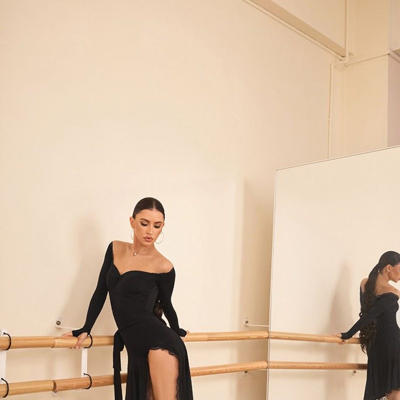 Black long sleeve dance dress with high slit, front view