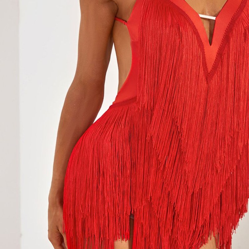 Red layered fringe on a Latin dance dress, close up