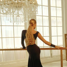 Black Latin dance set, back view at the barre