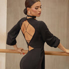 Black lace up open back dance dress, back view at the barre
