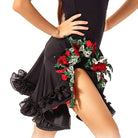 Red rose embroidery and ruffle hem on a dance dress, close up