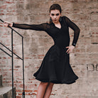 Black long sleeve flared dance dress, pose on the stairs