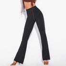 Black high waist Latin dance pants with a slight flare, side view