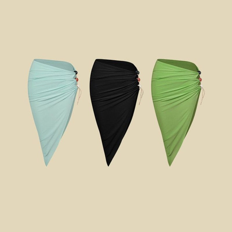 Aqua, Black, Green high slit ruched Latin dance skirt, flat lay of all three colours