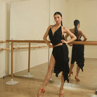 Black asymmetric ruffle skirt, front view at the barre