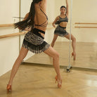 Zebra print fringe skirt, back view in motion