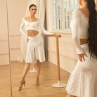 White polka dot skirt, side view in the mirror