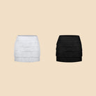 White, Black tiered fringe Latin dance mini skirt, flat lay of both colours