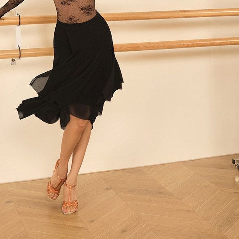 Black sheer mesh Latin dance skirt for salsa practice, waist-down view in motion