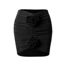 Black ruched rosette Latin dance mini skirt, flat lay