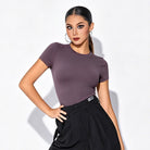 Mauve short sleeve dance top worn with practice pants