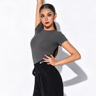 Grey short sleeve Latin practice top, arm raised