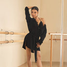Black oversized long sleeve tunic top, front view with one shoulder dropped