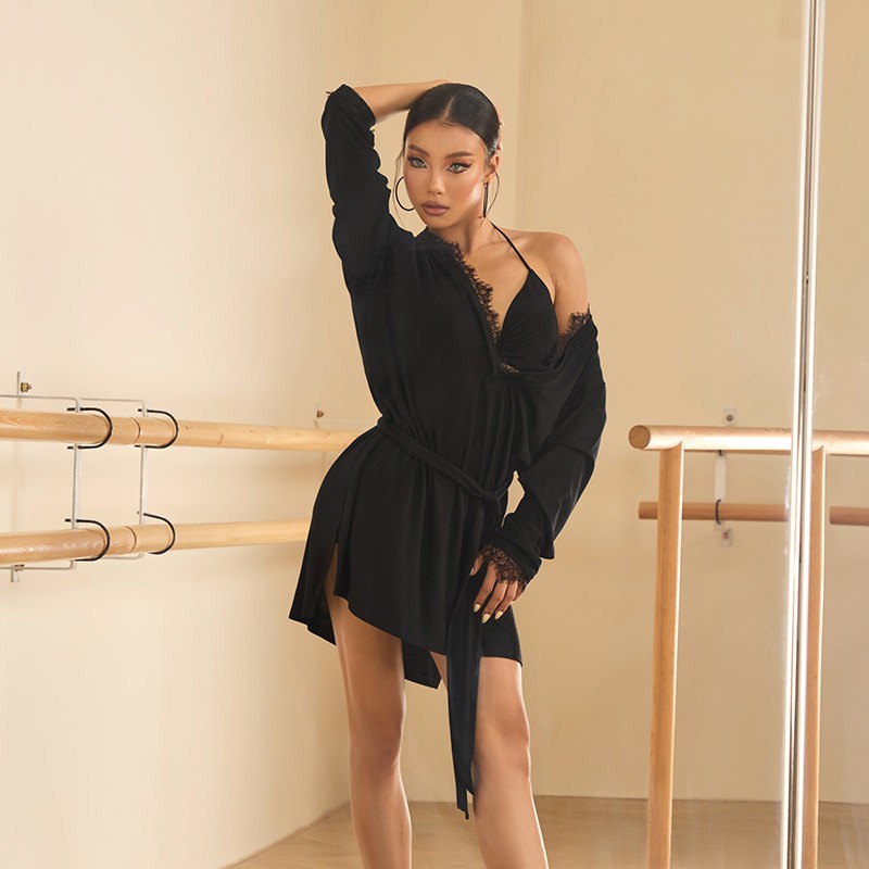 Black oversized long sleeve tunic top, front view with one shoulder dropped