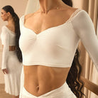 White lace trim long sleeve crop top, front close-up