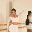 White lace trim long sleeve crop top, front view in the mirror