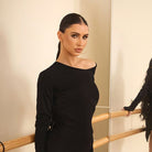 Black one shoulder long sleeve tunic top, front view at the barre