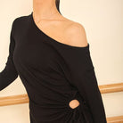 Black one shoulder long sleeve tunic top, close-up of the dropped shoulder