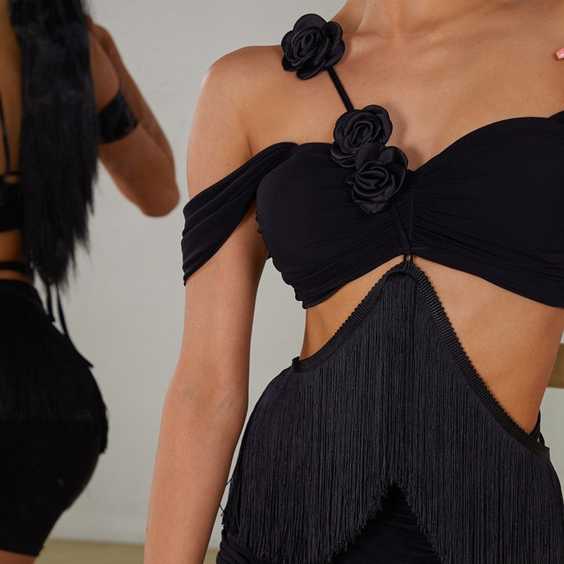 Black off shoulder fringe top, front close-up of the rosette and fringe