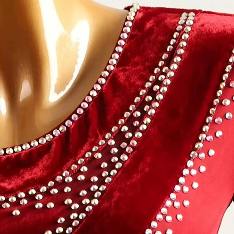 Close-up of rhinestone rows on the red velvet shoulder