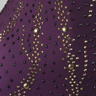 Close-up of gold stone trails on the purple bodice