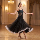 Black ballroom dance dress with a one shoulder rhinestone band and pointed tulle hem