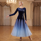 Navy ballroom dress worn by a dancer in a ballroom, full length front view