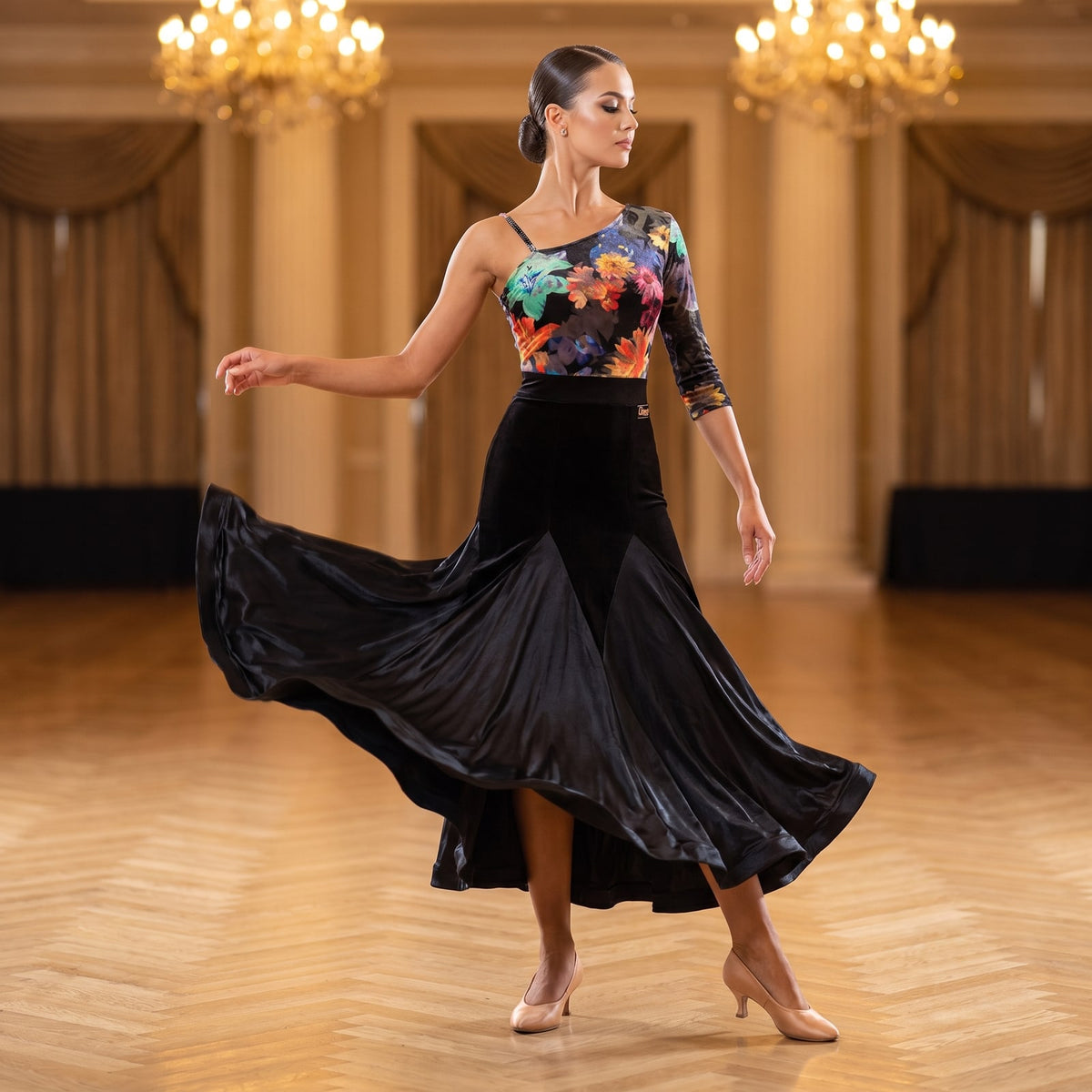 Floral print one shoulder ballroom dress with a black fishtail skirt turning in a ballroom