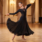 Black mesh waist ballroom practice dress with long sleeves and the godet skirt fanning out
