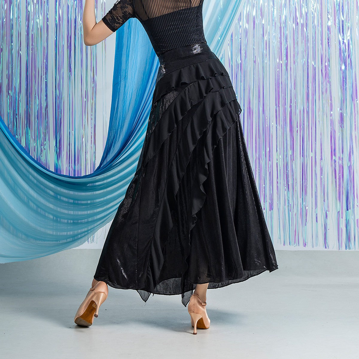 Black ballroom dance skirt, back view showing layered chiffon ruffles and long full hem