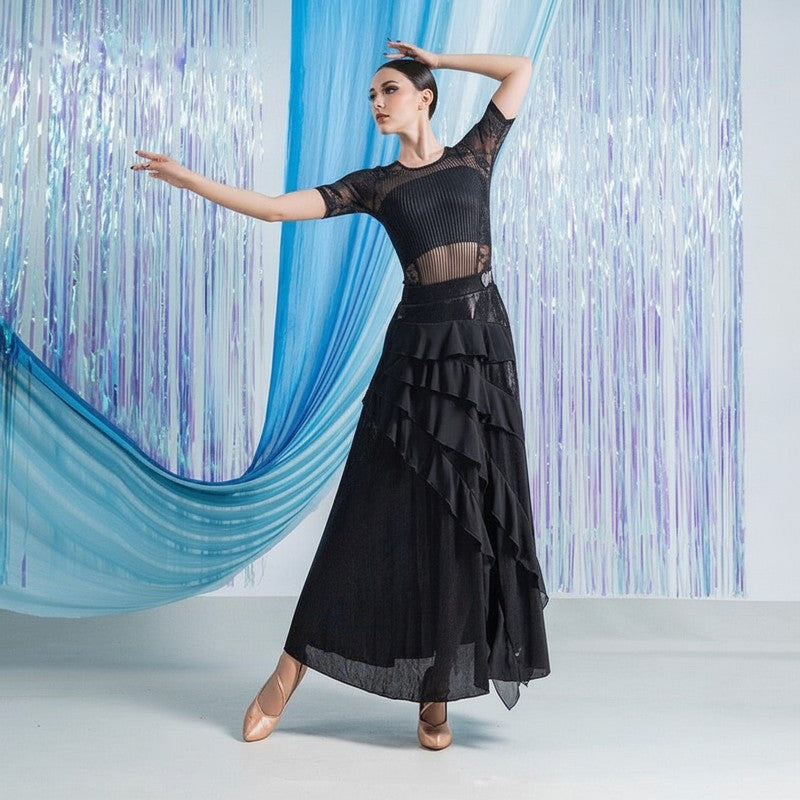 Diagonal ruffle tiers on the black ballroom practice skirt seen from the front