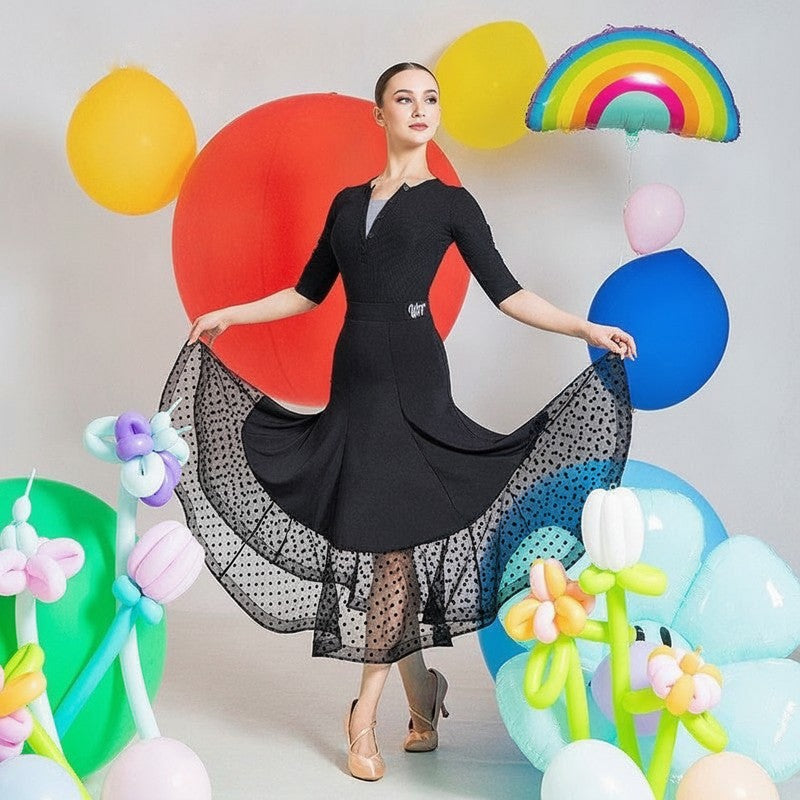 High waist black ballroom practice skirt with dot mesh hem seen from the front