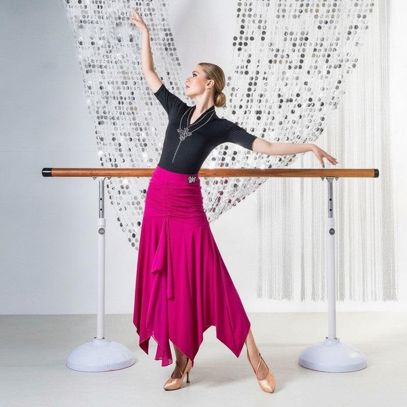 Fuchsia pointed hem ballroom practice skirt swept out through a turn