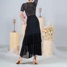 Black ballroom practice skirt with tiered sheer mesh hem, back view