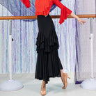 Black ballroom dance skirt with tiered ruffles down the front, side view