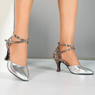 Woman wearing silver snakeskin print closed toe ballroom dance shoes, waltz heels with crossed ankle strap