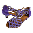 pair of purple satin dance shoes for women with low heel and geometric rhinestone cutout uppers