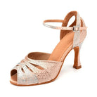 nude satin ballroom dance shoe for women covered in rhinestones with peep toe and ankle strap