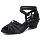 black latin dance shoe for women with a fanned cutout vamp, crossed cutout ankle straps and a low block cuban heel