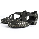 Black ballroom dance shoes pair with metallic gold peacock-eye print, closed round toe and crossed elastic straps on a low block heel