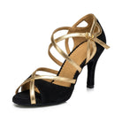 Black and gold latin dance shoe for women, suede toe band crossed by two metallic gold straps, looped gold heel cup and slim heel