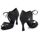 pair of black satin lace-up dance booties for women set with black rhinestones and pearls