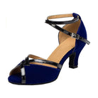 blue suede latin dance shoe for women with black patent crossed straps, scalloped topline and a low flared heel
