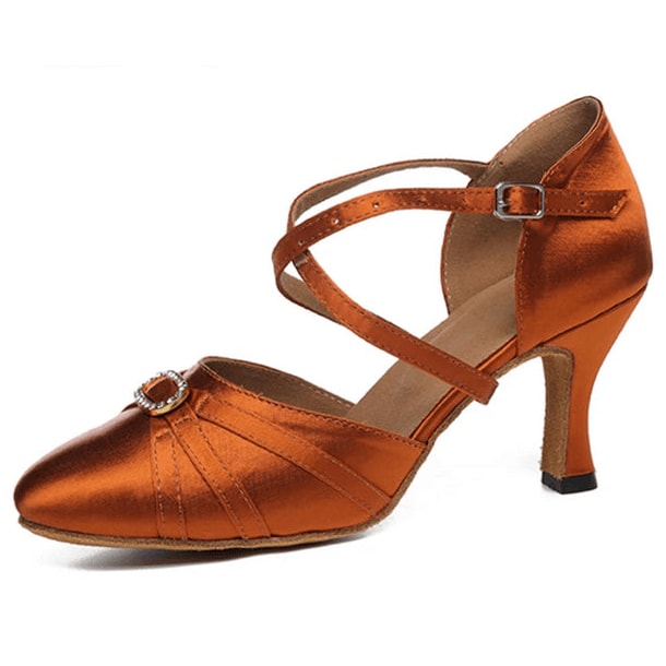 tan satin closed-toe ballroom dance shoe with crisscross ankle strap, rhinestone buckle, pleated toe