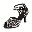 zebra print dance shoe for women with rhinestone-lined toe straps and crystal-studded flared heel