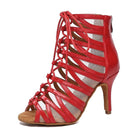 red patent caged lace-up dance boot for women over nude mesh with a tan sole and stiletto heel